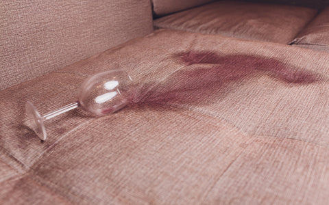 Wine spill on a dark ccolored sofa